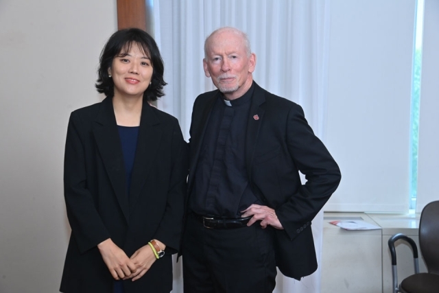 Fr. Shanley and faculty member