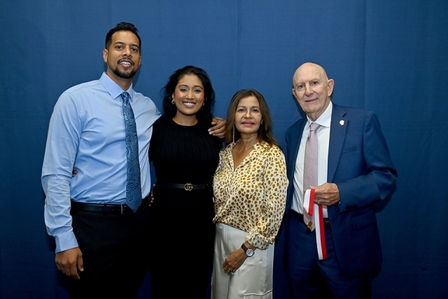 Honoree gathered with three other individuals for photo
