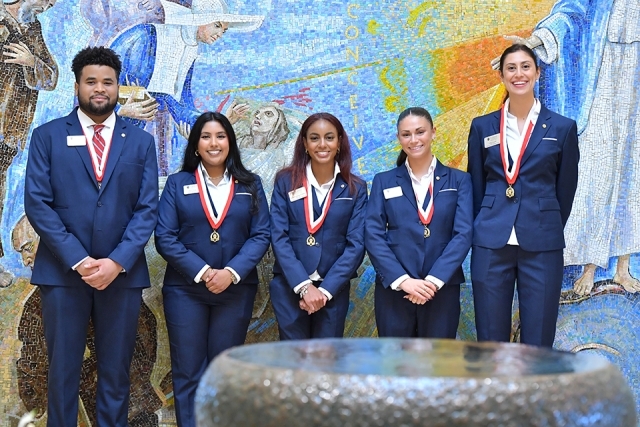President's Society members in church lobby