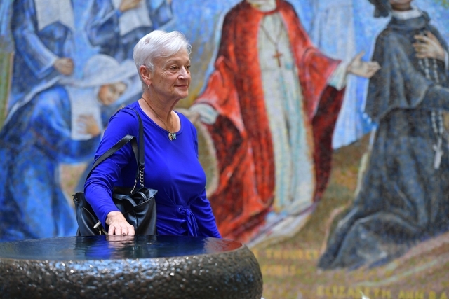 Female walking in church lobby