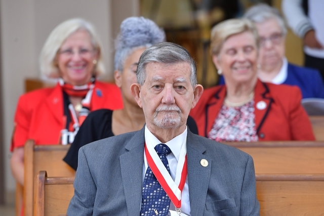 Inset of honoree sitting in pew