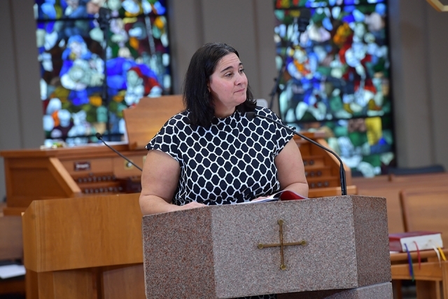 Female speaking at ambo