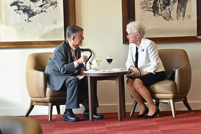 Two men sitting and talking