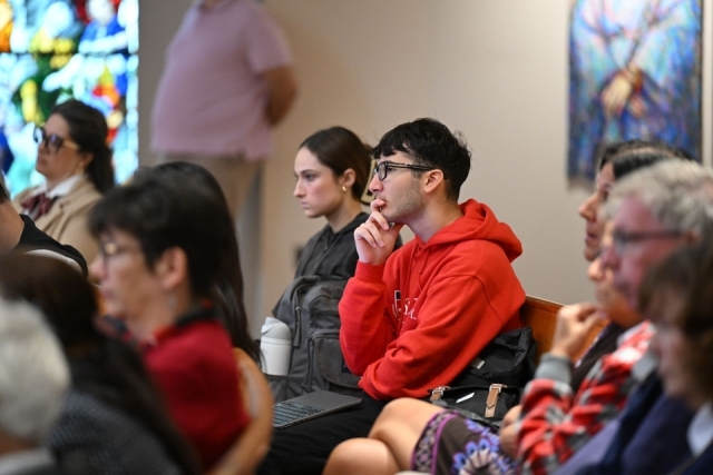Inset of individuals listening in the pews