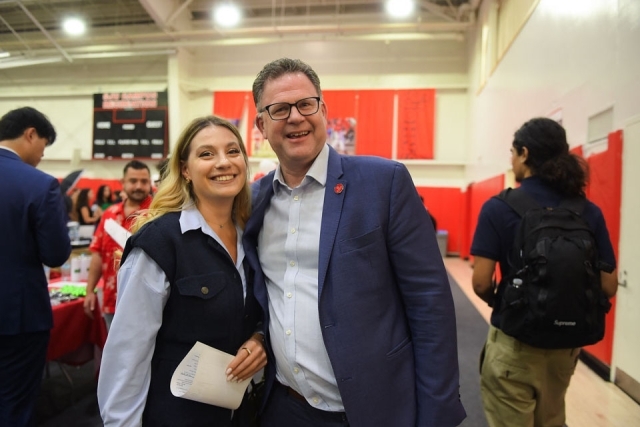Professor Kinsley and female pose for photo