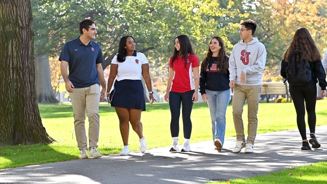 Students walking together outdoors on campus