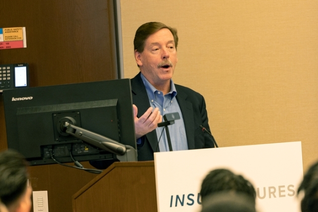 Man speaking at the podium 