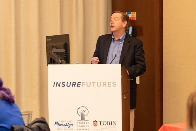 Man speaking at the podium 