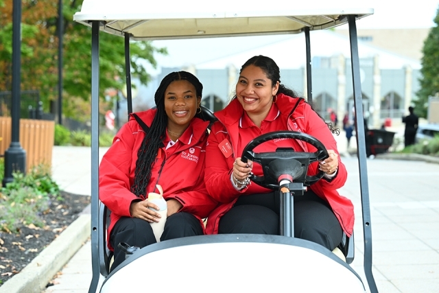Student ambassadors on golf cart