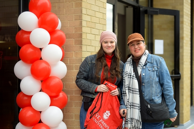 Female prospective student and family member