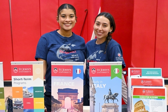 Female student employees at campus fair