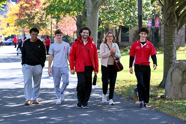 Prospective students and family members walking outside