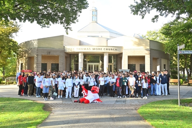 University Service Day participants in front of St. Thomas More Church