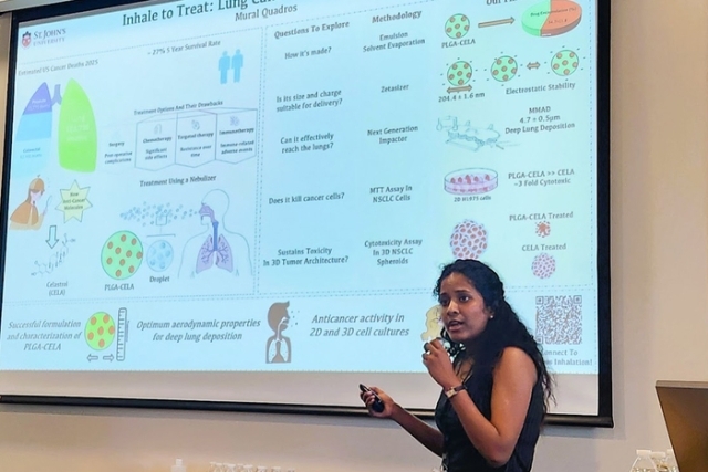 Young woman speaking in front of a projector with project 