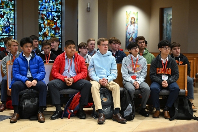 High school students seated in pews