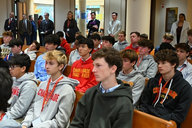 High school students seated in pews