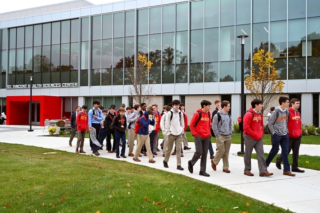 High school students walking outside Health Sciences Center