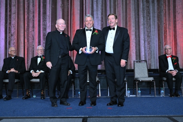 Fr. Shanley and honoree onstage