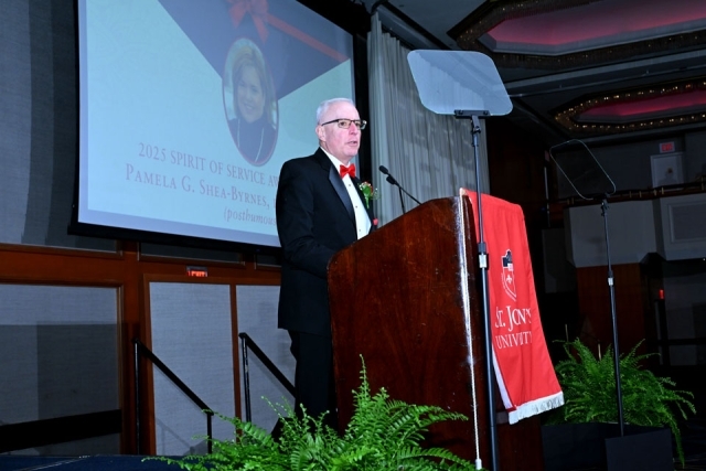 Honoree speaking at podium