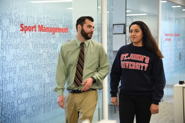 St. John’s Master’s Program in Sport Management Student walking with faculty