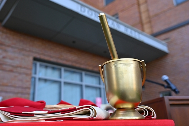 holy water bucket on table outside of Donovan Hall