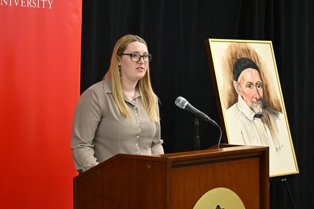 woman speaking at podium