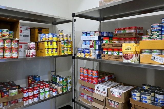 Stocked shelves of food items in food pantry