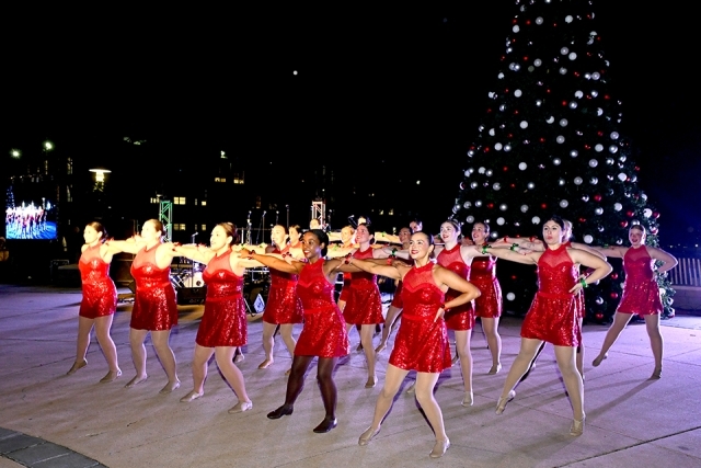 Dancers performing in red costumes