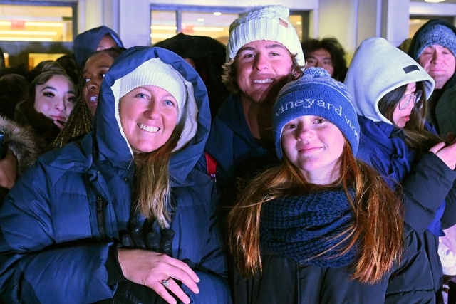 Three students smiling