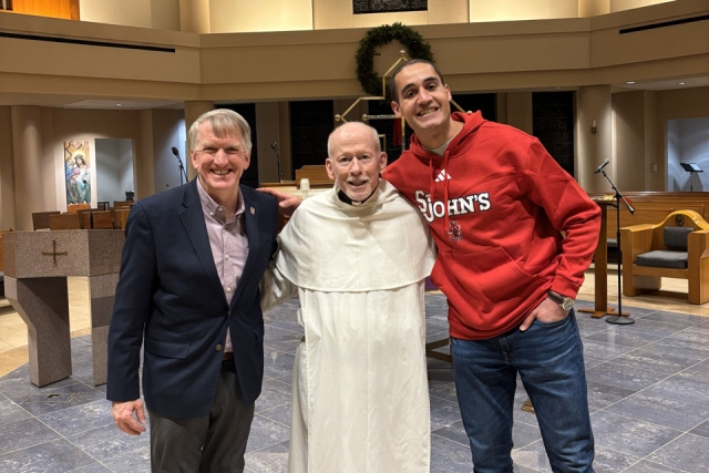 Brian Browne, Fr. Shanley and Adam Llorens in St. Thomas More Church