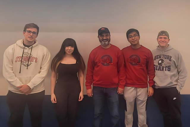 Group of men and women smiling 