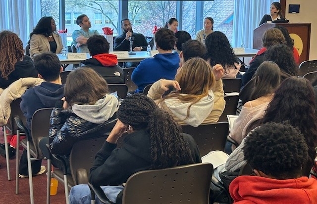 Group of students sitting at a lecture 