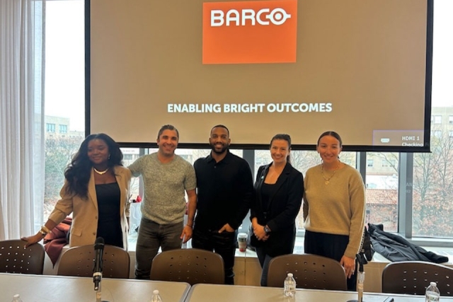 Group of men and women smiling 