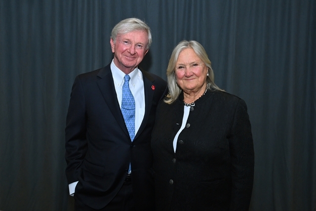 Two attendees smiling and posing together during the St. John’s University Insurance Leader of the Year Award Dinner.