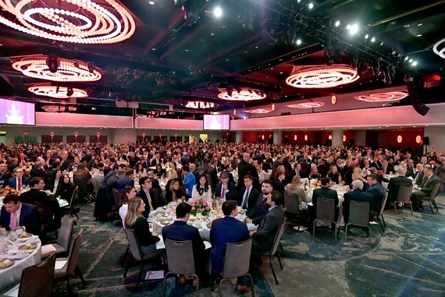 Wide view of a large banquet hall filled with seated guests attending the Insurance Leader of the Year Award Dinner.