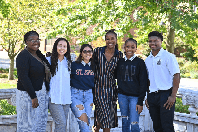 Image of students and a staff member of the St. John's University Student Empowerment Workshop Program