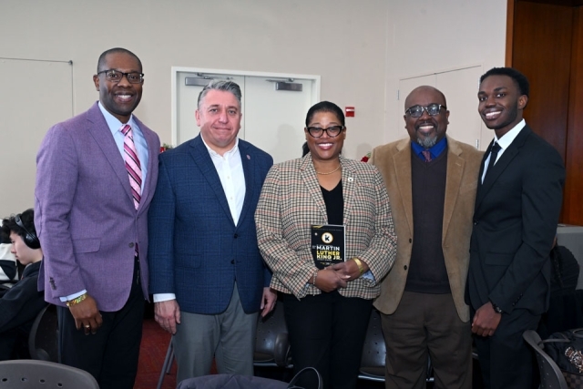 Group photo of university leaders and guests posing together at the Martin Luther King Jr. Legacy Dinner.