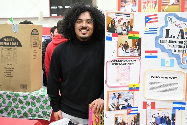 student next to a presentation board