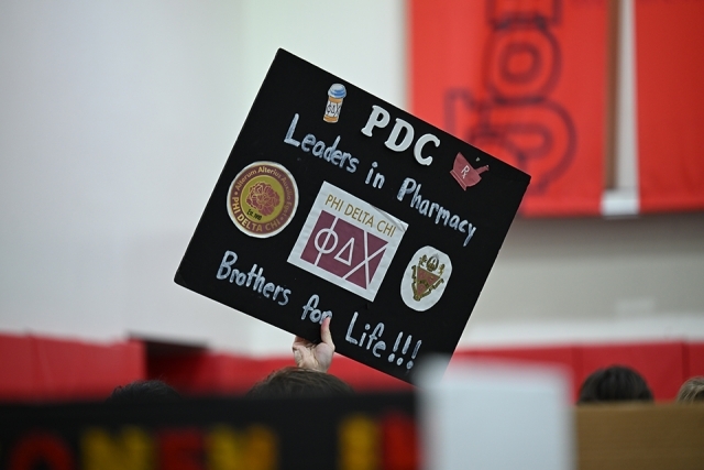 Student holding a sign 