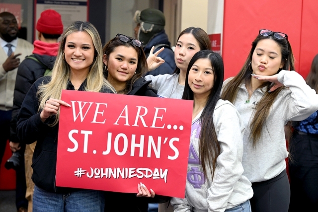 Students holding a sigh saying "We Are St. John's" 