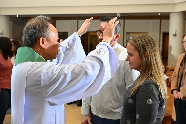 Priest blessing a couple 