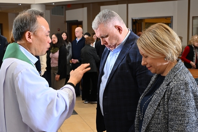 Priest blessing a couple 