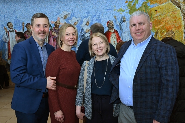 Group of men and women posing for a picture 