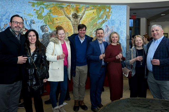 Group of men and women posing for a picture 