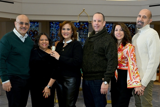 Group of men and women posing for a picture 
