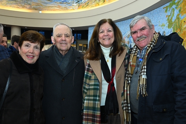Group of men and women posing for a picture 