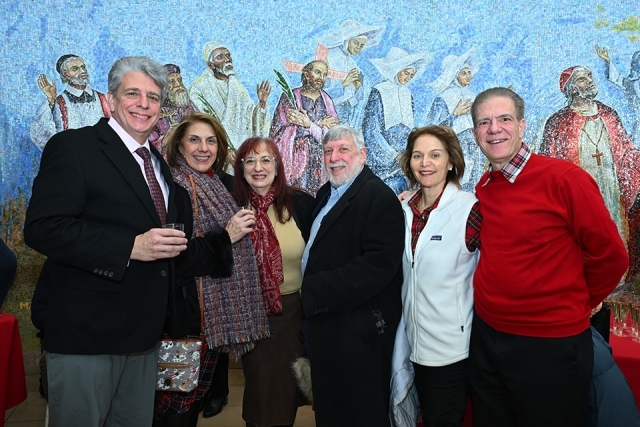 Group of men and women posing for a picture 