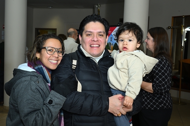 Couple holding a child 