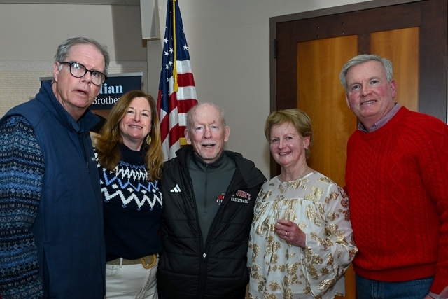 Group of men and women posing for a picture 
