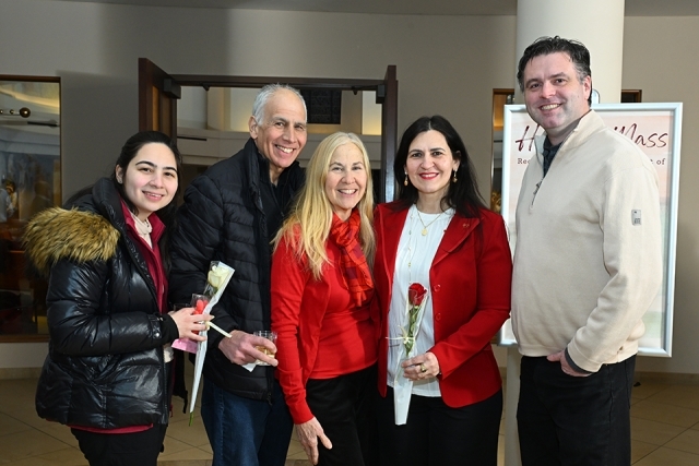 Group of men and women posing for a picture 